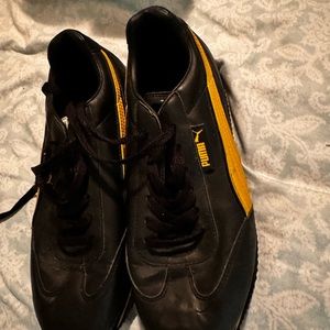 Black and yellow retro puma shoes